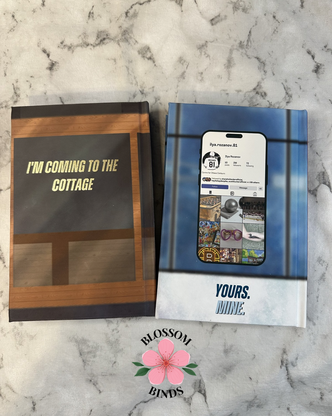 Two books on a marble surface with 'Blossom Binds' logo.
