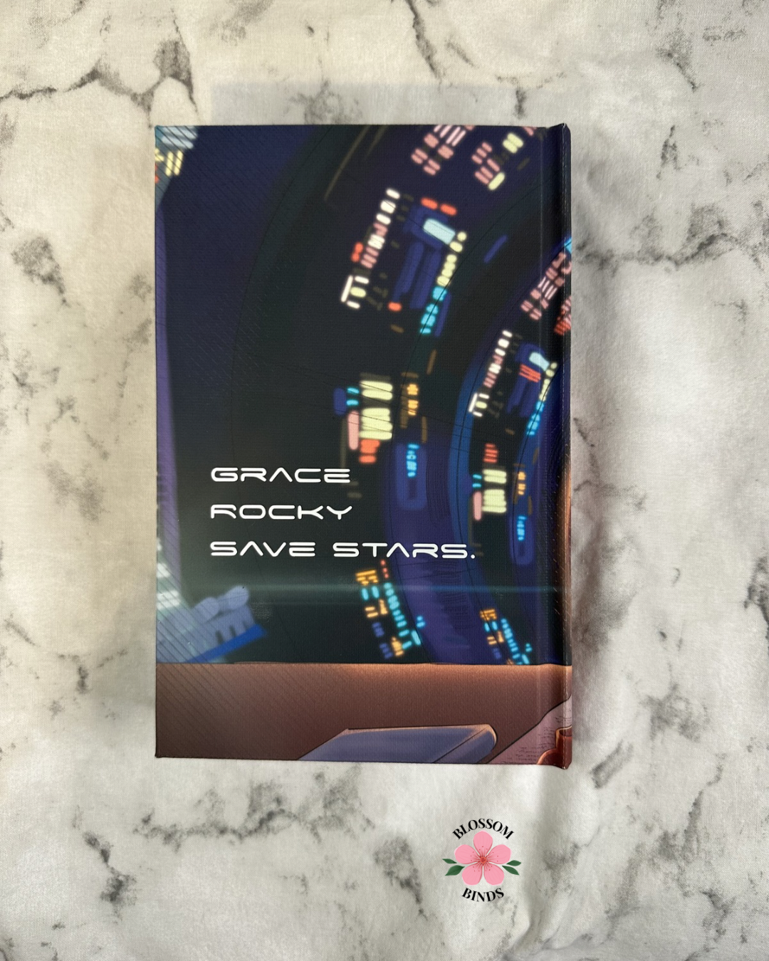 Book with colorful text design on a marble surface