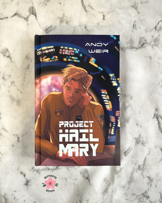 Book cover of 'Project Hail Mary' by Andy Weir on a marble surface