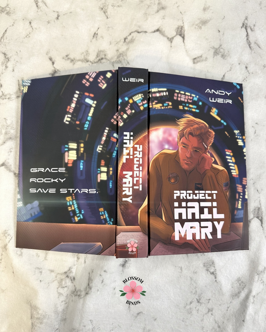Flat lay display of "Project Hail Mary" full cover on marbled surface